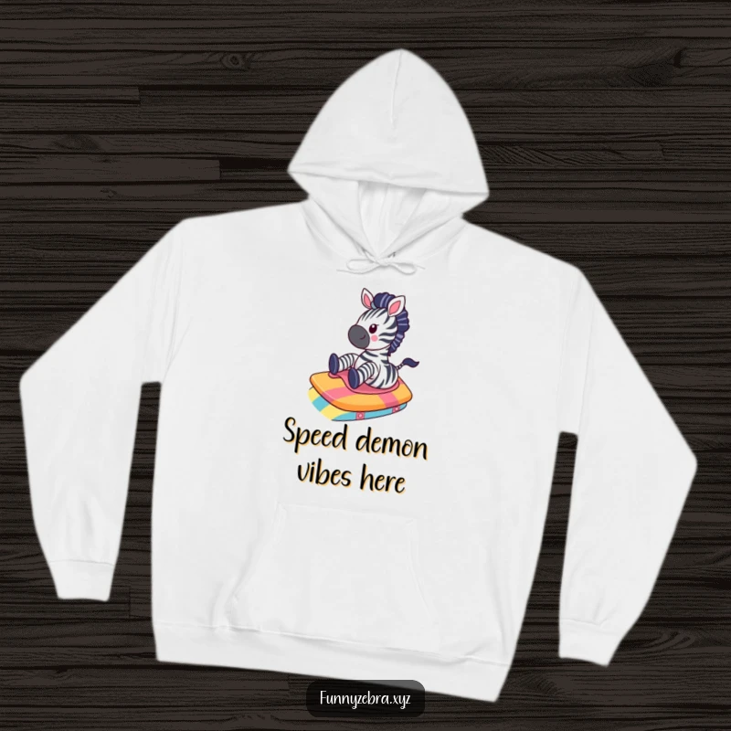 Funny Kawaii Zebra Hoodie: A charming zebra gleefully slides down a colorful ramp, exuding warmth and playful, comedic vibes.